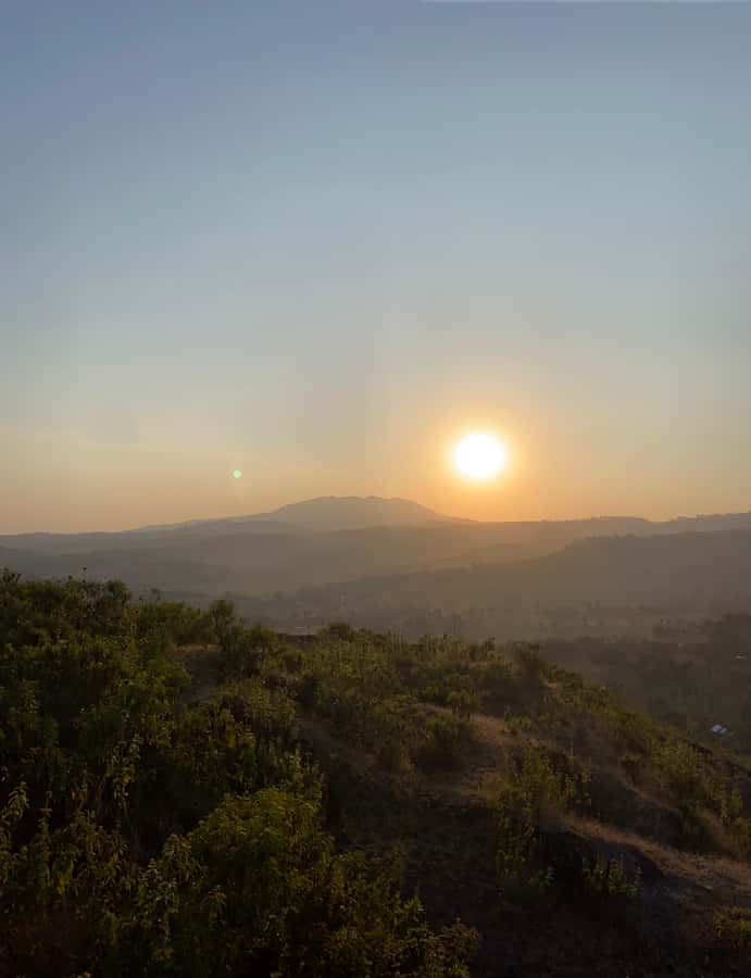 Arusha: Golden Hour Walk & Sunset Viewpoint Over Mount Meru - The climb to the hilltop: comfort, shoes, and sunset timing