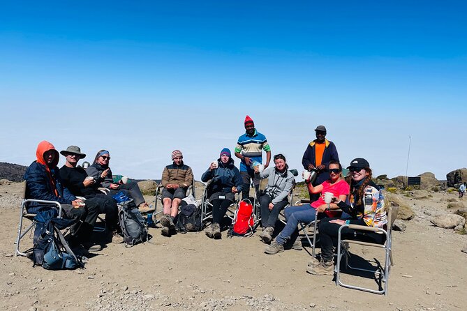 Day trip Materuni watsrfalls and chemka hotsprings tour - Descent Through Rainforest to Mweka Gate and Summit Certificates