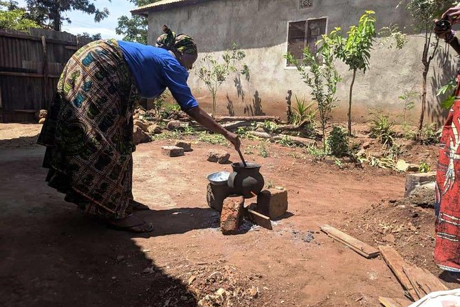 Private Market Tour and Tanzanian Cooking Class in Moshi - Learning coconut milk with the buzi (traditional tool and real work)