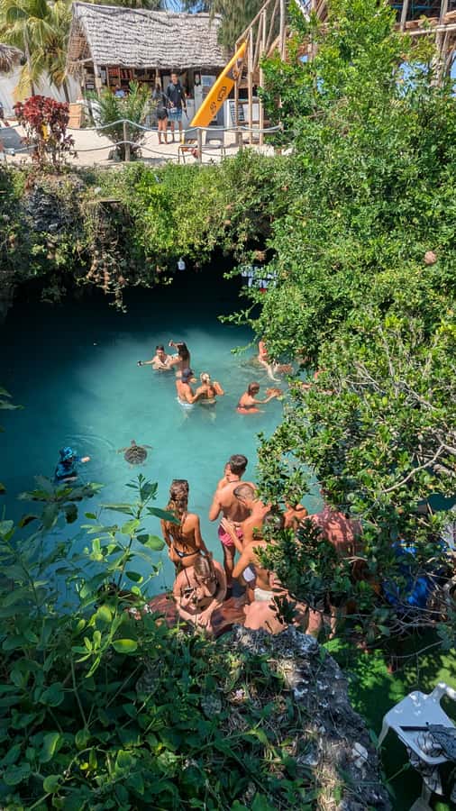 Salaam Cave Swimming with turtles, Mtende Beach & The Rock - Mtende Beach on Zanzibar’s south coast: clear water and coral-cliff scenery