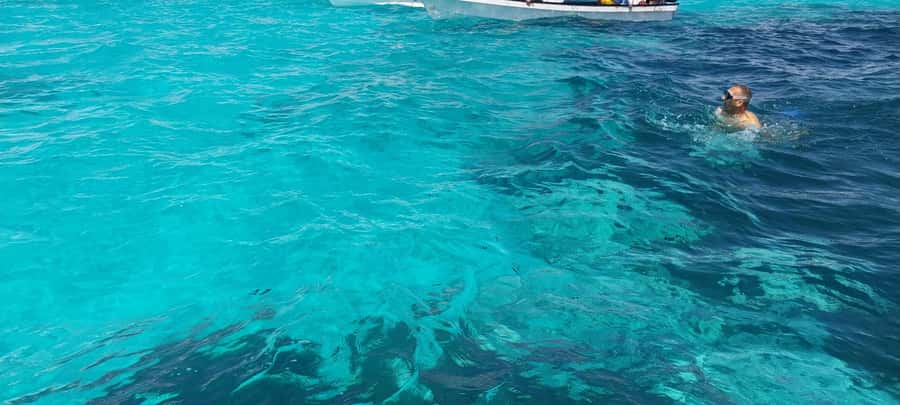 Zanzibar: Mnemba Island Dolphin and Snorkeling Tour - Snorkeling Mnemba Atoll: clear water, coral views, and real safety