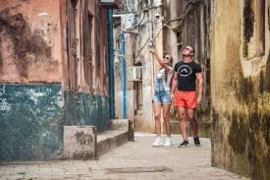 Zanzibar: Stone Town Walking Tour With Hotel Pickup - Darajani Market stop: where colors and spices meet real shopping