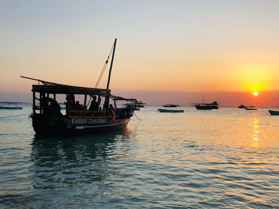 Zanzibar: Sunset Dhow Cruise With Pick Up - Onboard comfort: fruit, water, refreshments, and real music